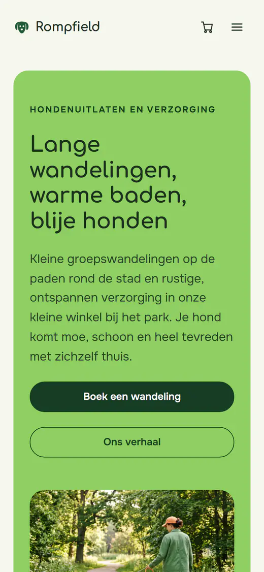 Websitesjabloon voor hondenuitlaten en trimmen, op een telefoon