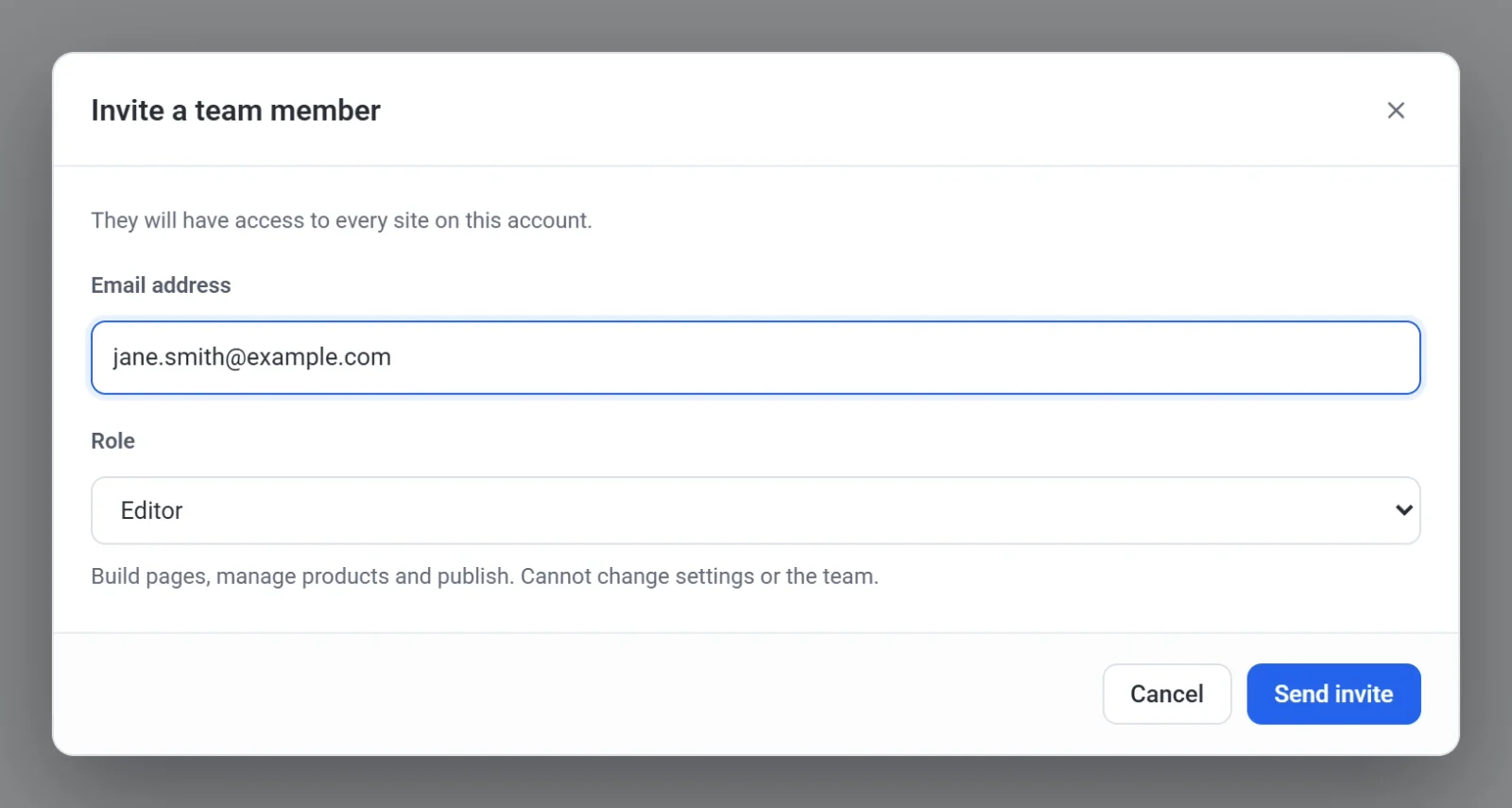 The Invite a team member dialog with the email address jane.smith@example.com and the role Editor selected