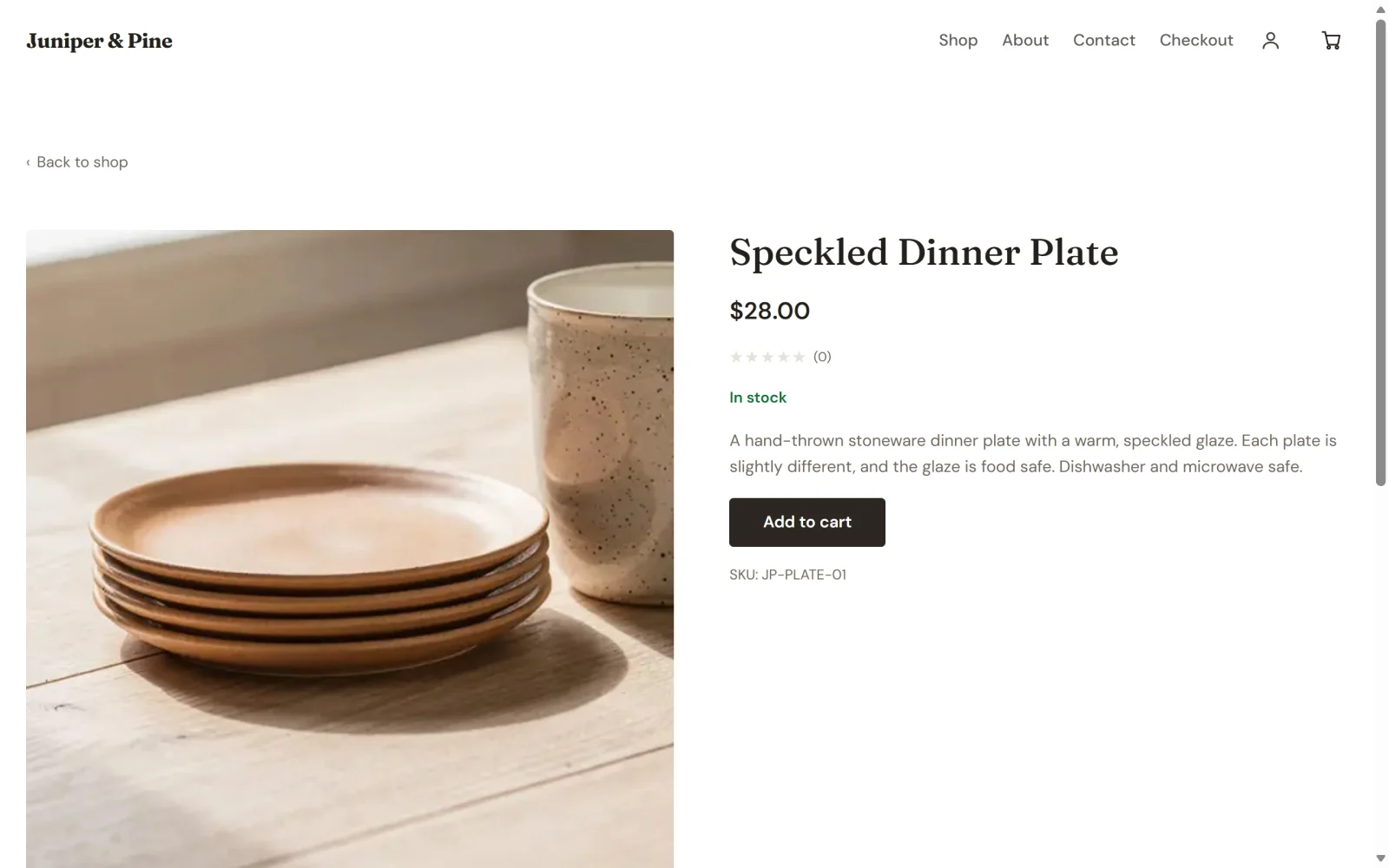 The live product page for the Speckled Dinner Plate, with a large photo on the left and the name, price, In stock note, description, Add to cart button and SKU on the right